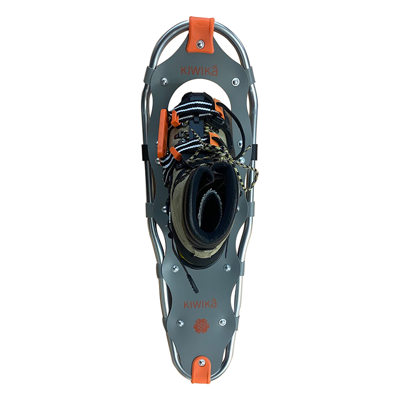 Hiker wearing snowshoes trekking through deep snow – Kiwika winter gear